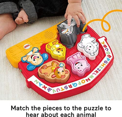 Close-up view of the durable plastic cow and horse puzzle pieces designed for small toddler hands.