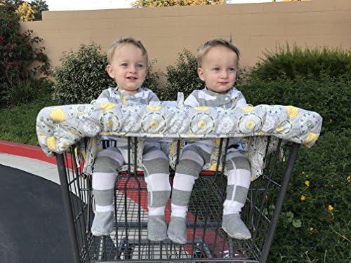 Twinventions double baby cart protector folded compactly inside its attached gray medallion carrying case.
