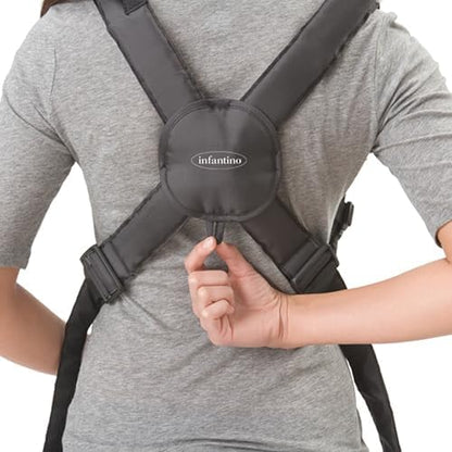 Detail view of the soft interior seating pouch designed for comfortable inward and outward infant carrying.