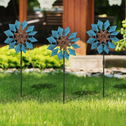 Three Aoutrow wind spinners arranged in a lawn display