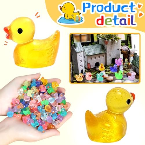 Waterproof miniature resin ducks placed inside a colorful home aquarium micro landscape decoration.