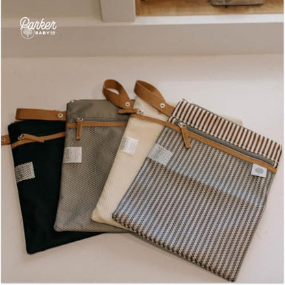 Parker Baby Co. wet dry bag holding diapers and baby essentials