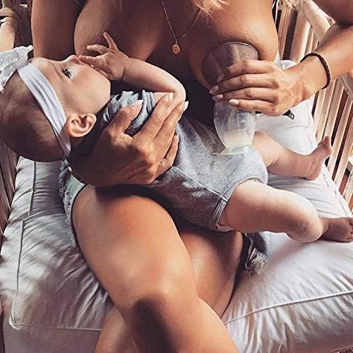 Haakaa manual silicone breast pump with the white flower stopper inserted tightly in the neck to demonstrate spill-proof protection.