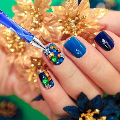 Tatuo manicure dotting pen set being used to apply small crystal gems onto a detailed nail art design.
