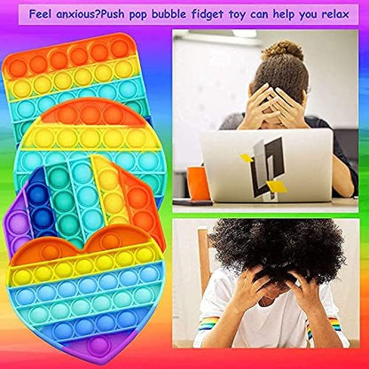 Vibrant rainbow colored heart shaped bubble sensory popper toy close up view.