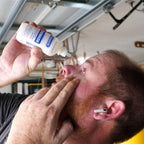 PhysiciansCare eye wash bottle showing 120 milliliter volume and sterile labeling.