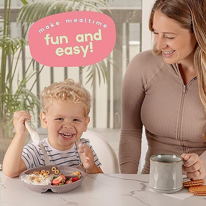 Child using ChériKid suction plate for self feeding