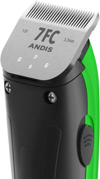 Andis pet nail clipper and blade oil accessories laid out on a clean surface.