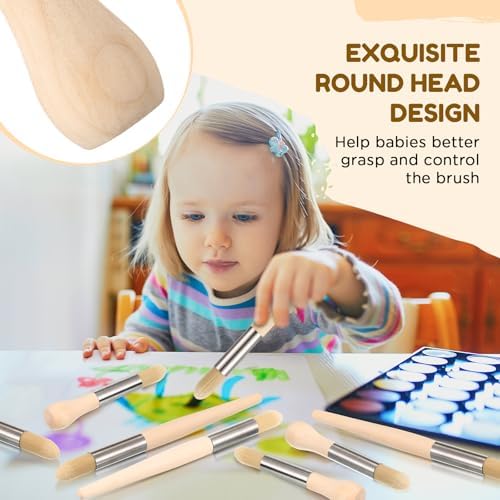 A young toddler holding the easy grip chubby wood handle paint brush