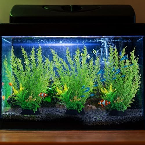 QUOZUO plastic aquarium plants installed securely inside a freshwater fish tank.