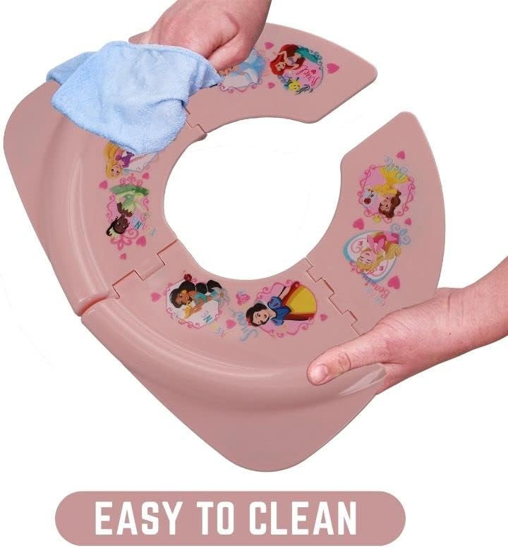Toddler folding toilet seat being placed into its clear hygienic zip lock storage bag