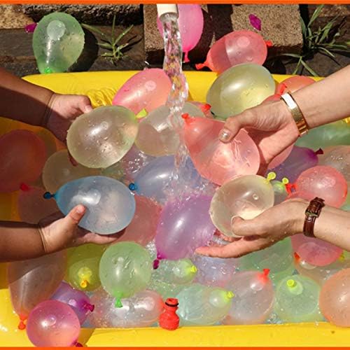 Kids and adults enjoying an outdoor water bomb fight game in a backyard setting.
