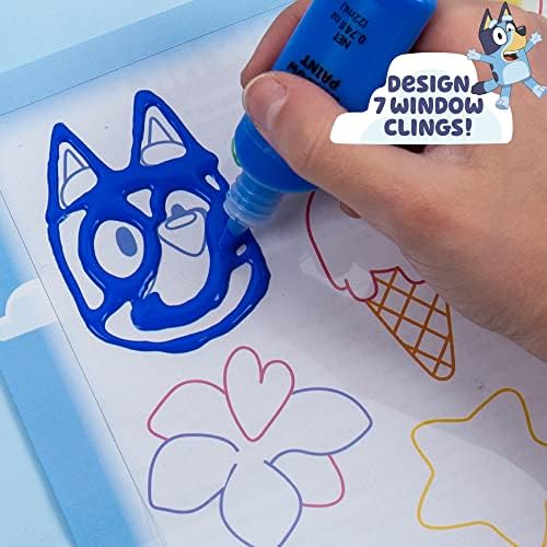 Acetate tracing sheet being used to create custom DIY window clings of favorite show characters.