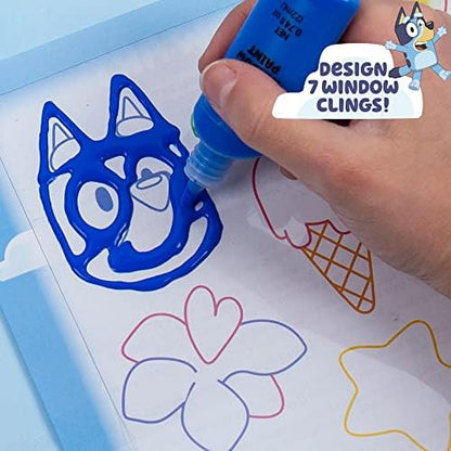 Acetate tracing sheet being used to create custom DIY window clings of favorite show characters.