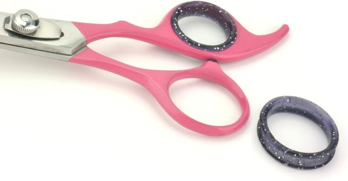 Anxious cat being calmly groomed with the pink Scaredy Cut manual silent clipper alternative.
