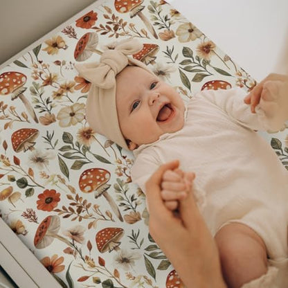 Baby changing table mat with woodland mushroom design