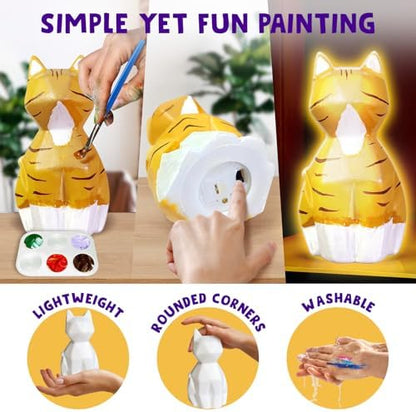 Fully painted cat lamp glowing with a warm soft bedside light