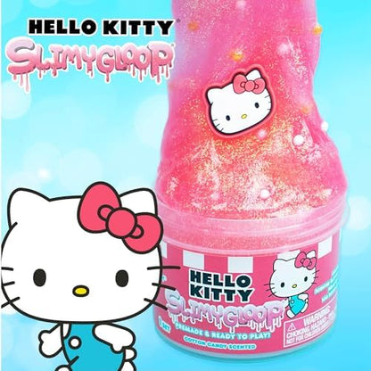 Scented pink glitter slime being stretched to show its smooth texture and color transformation.