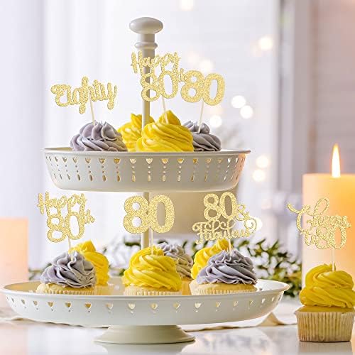 Party table setting with gold 80th birthday anniversary toppers