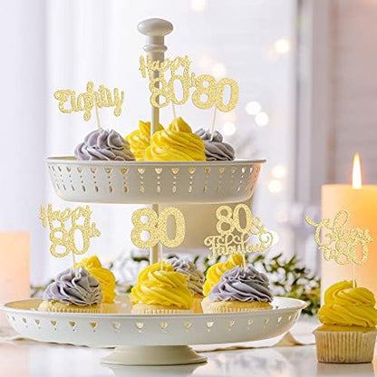 Party table setting with gold 80th birthday anniversary toppers