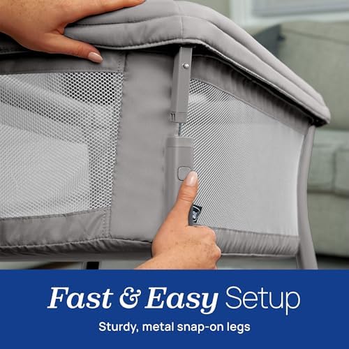 Compact and space saving footprint of the Chicco portable bassinet next to a bed.