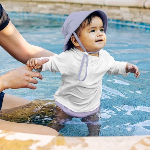 Toddler wearing Green Sprouts lavender swim diaper at the beach