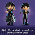 Close up view of LEGO Wednesday Addams accessories including typewriter and black dahlias