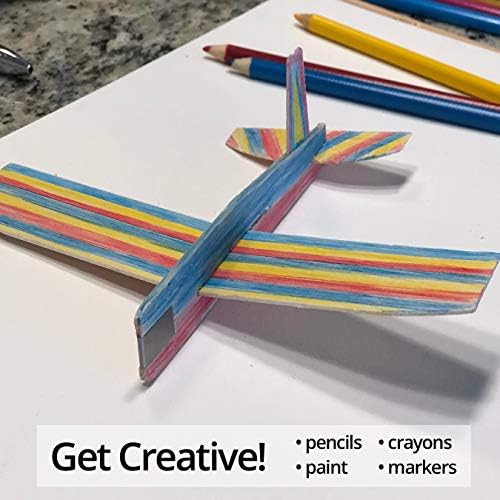 Children decorating the smooth wood surface of an imported miniature glider using colorful markers.