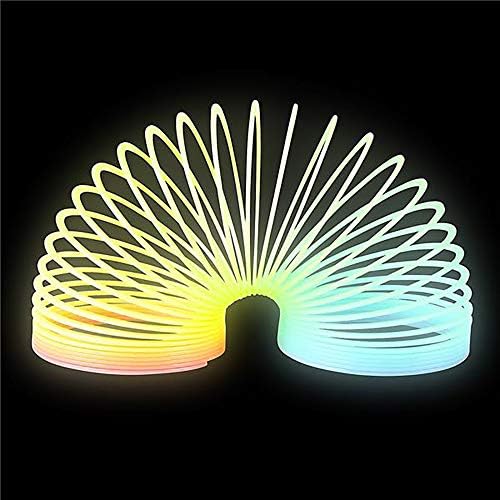 Side view of the three inch glow in the dark toy walking down a set of wooden steps.