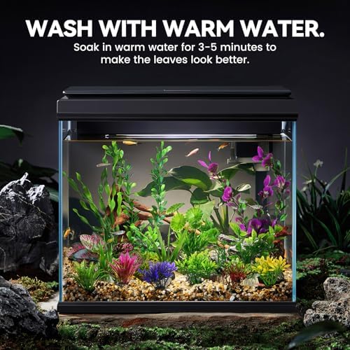 Different sizes of colorful artificial aquatic plants arranged to create vertical layers in a tank landscape.