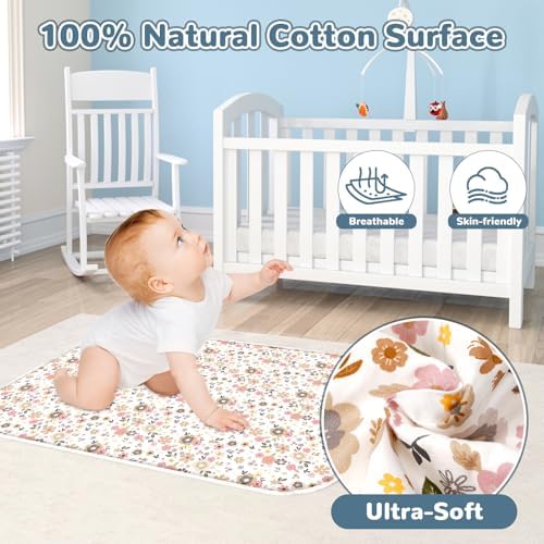 Extra large waterproof changing mat laid flat on a bed showing its generous size.