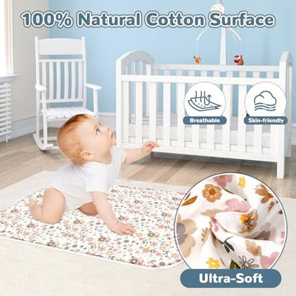 Extra large waterproof changing mat laid flat on a bed showing its generous size.