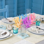 Four piece set of TOPZEA artificial marine coral in pink beige purple and blue on a living room shelf