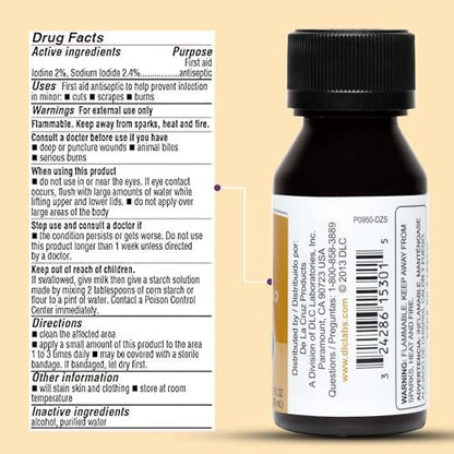 De La Cruz iodine solution bottle held in hand for scale