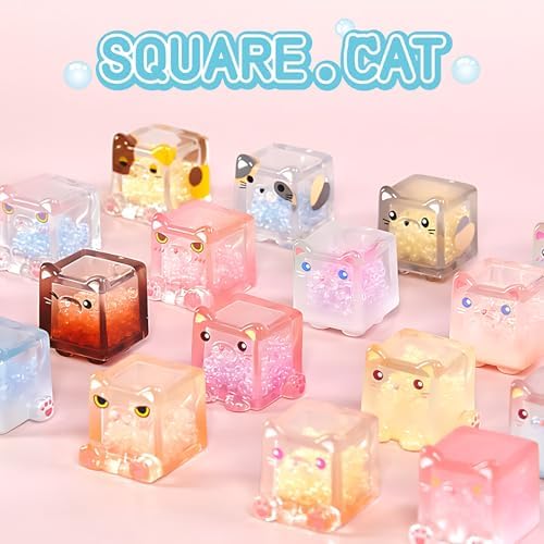 Stacked display of multiple square cat series mystery toys.