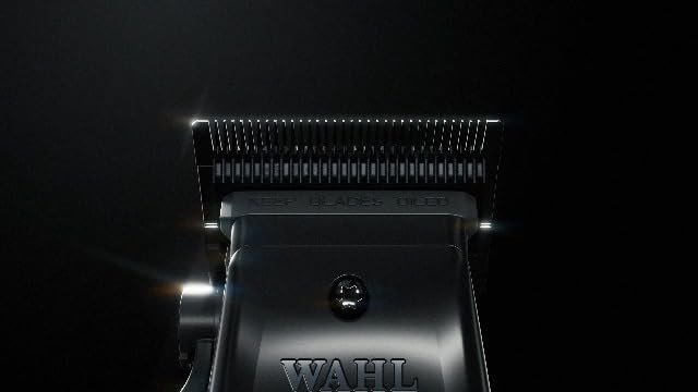 Wahl Professional 5-Star Vapor Clipper being plugged in for corded operation mode.
