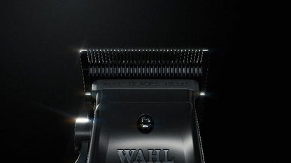 Wahl Professional 5-Star Vapor Clipper being plugged in for corded operation mode.