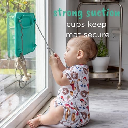 Busy Baby suction placemat with four attached toy tethers holding baby essentials.