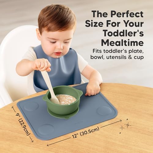 Toddler eating snacks directly off the non slip food grade silicone placemat