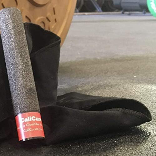 Athlete using CaliCure tool to smooth hand calluses for rock climbing