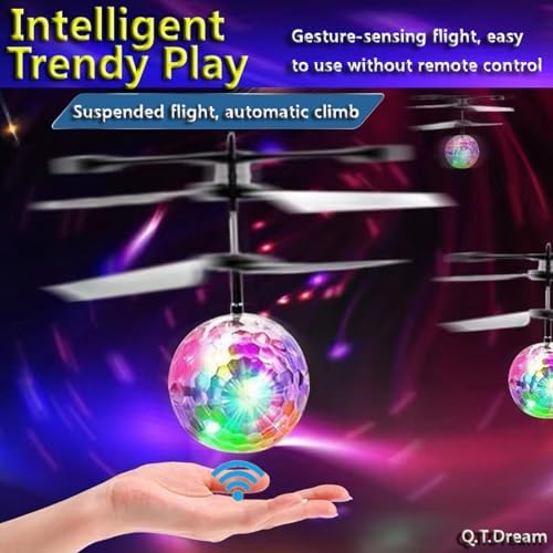 Motion controlled suspended flying ball hovering above a hand indoors.
