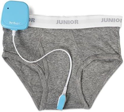 DryEasy Plus wireless transmitter module demonstrating the wire-free setup for pajamas.