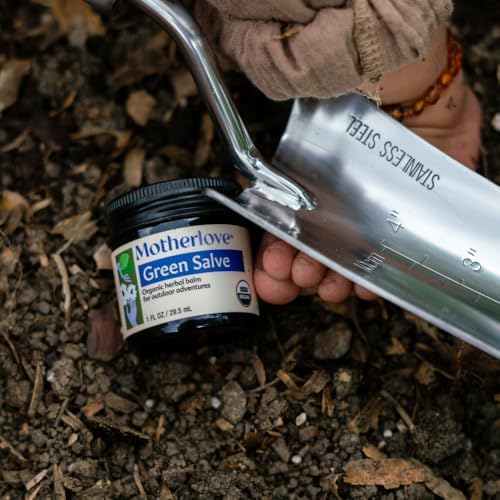 Motherlove Green Salve jar with ingredients list featuring plantain and marshmallow root.