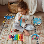 Eco friendly natural wood musical toys for boys and girls packaged inside the travel bag.