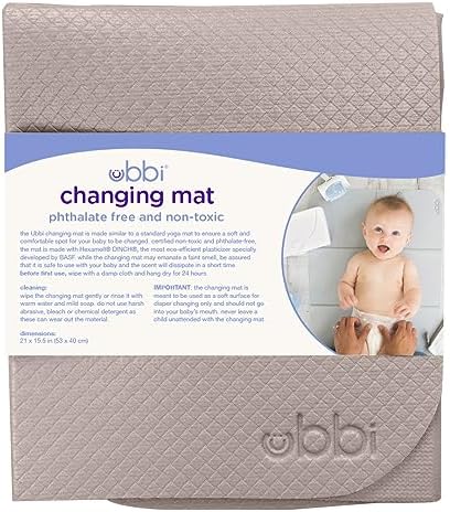 Ubbi baby travel accessory unfolded on a surface