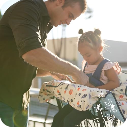 Integrated safety harness buckle system on the GoldBug baby shopping cart liner.