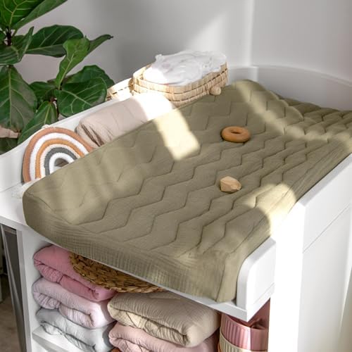 Lulumoon baby cotton diaper changing sheet displaying the deep elastic pockets for a secure fit.