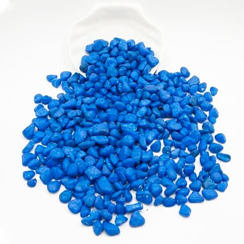 Decorative blue stones inside a glass vase filler
