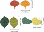 Double sided leaf design cat mattress pad spread on a living room floor.