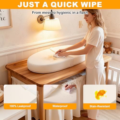 Waterproof vegan leather baby changing mat surface repelling liquid droplets close up view